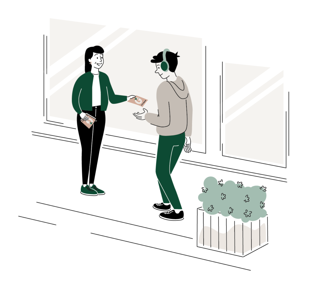 Vores kandidat, Gitte Hansen deler en pjece ud til en vælger